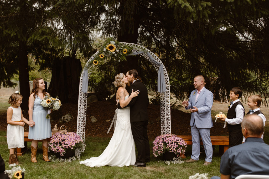 Bride and groom's first kiss at their wedding ceremony