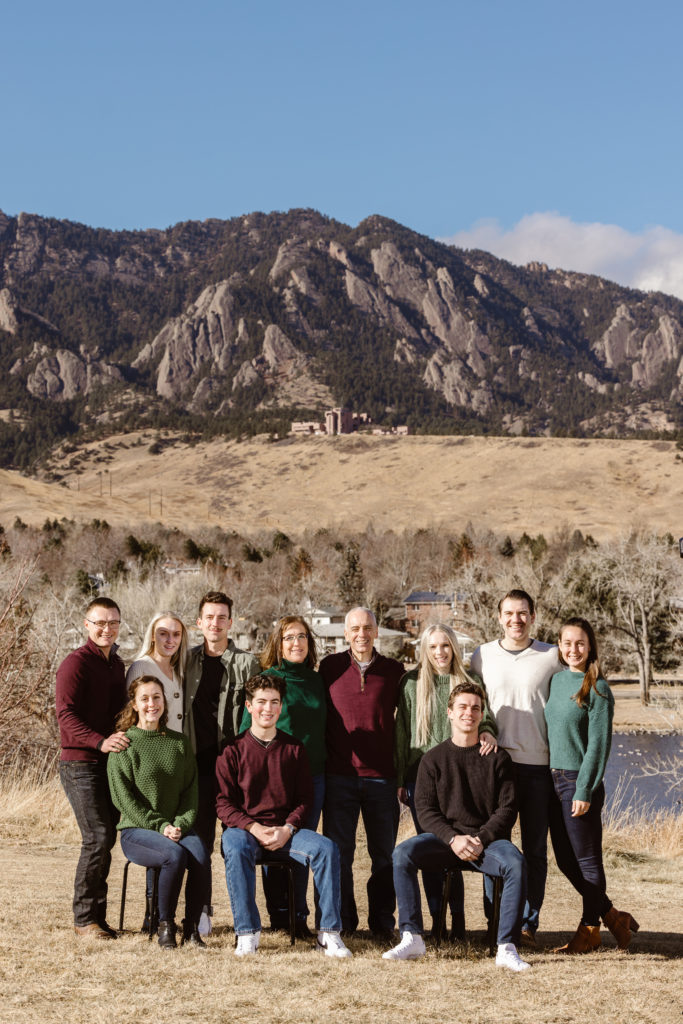 Large family photo with the Flatirons in the background