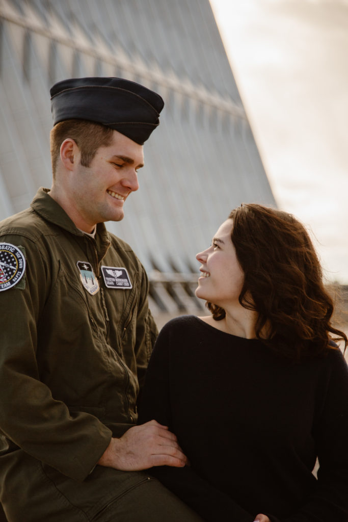 Man in Air Force uniform outside the United States Air Force Academy Cadet Chapel looking at his fiancé