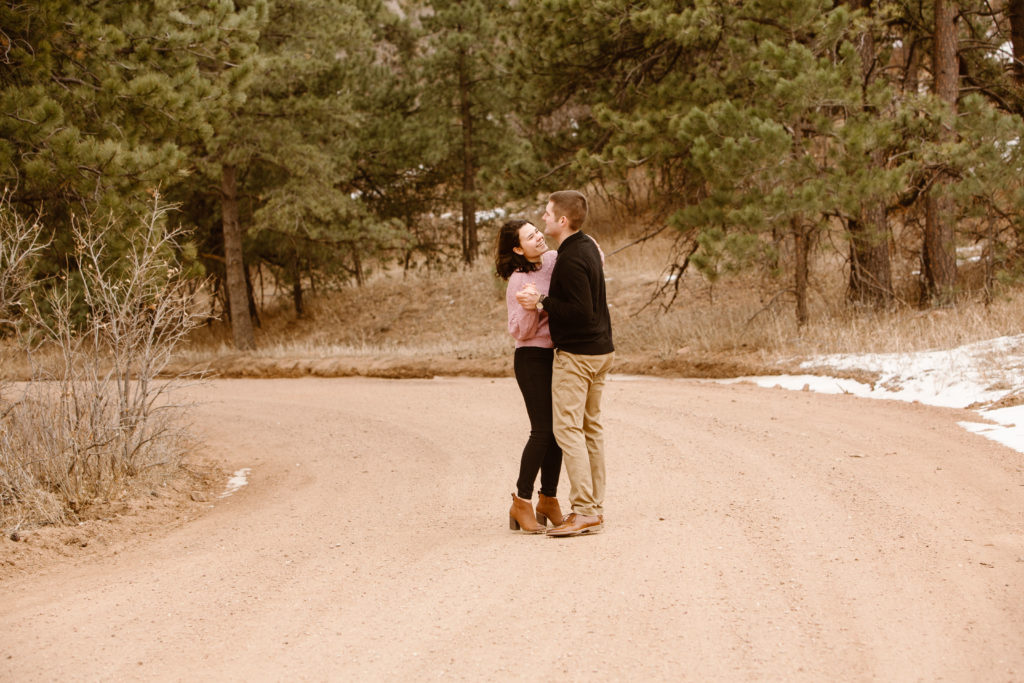 Couple dancing on a dirt road