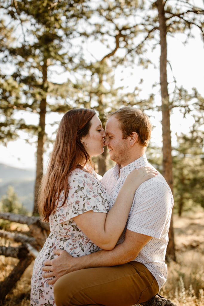 Woman kissing fiancé on the nose