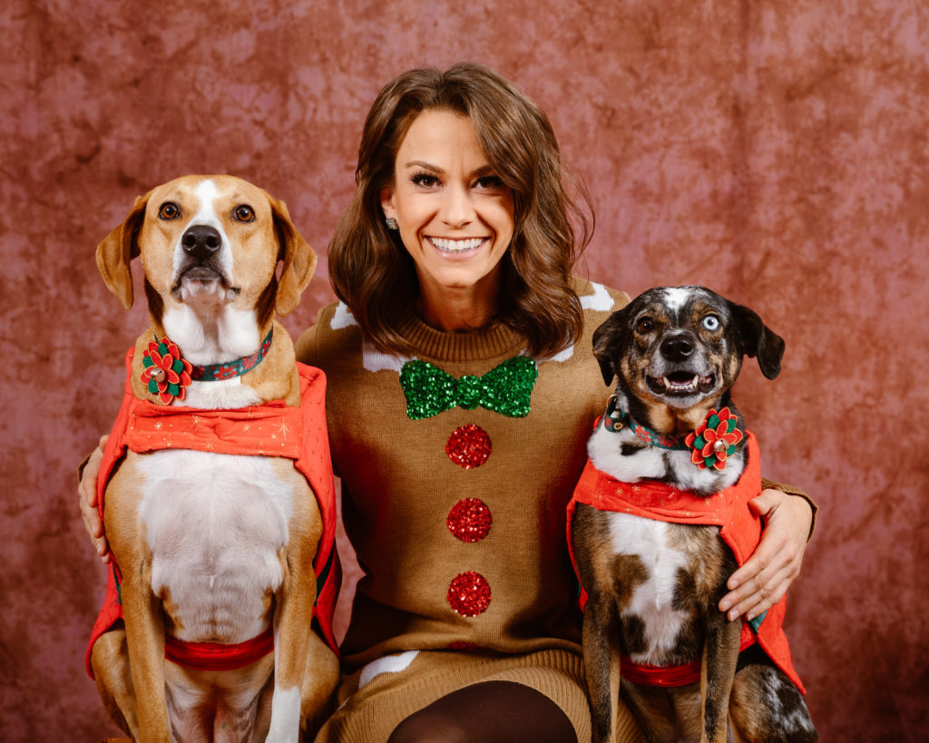 Woman with her dogs in a Christmas portrait taken by Simply Cassandra