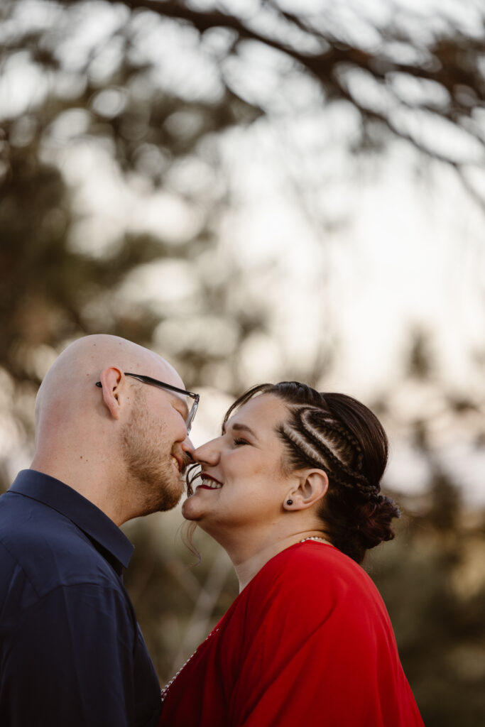 Couple about to kiss while smiling