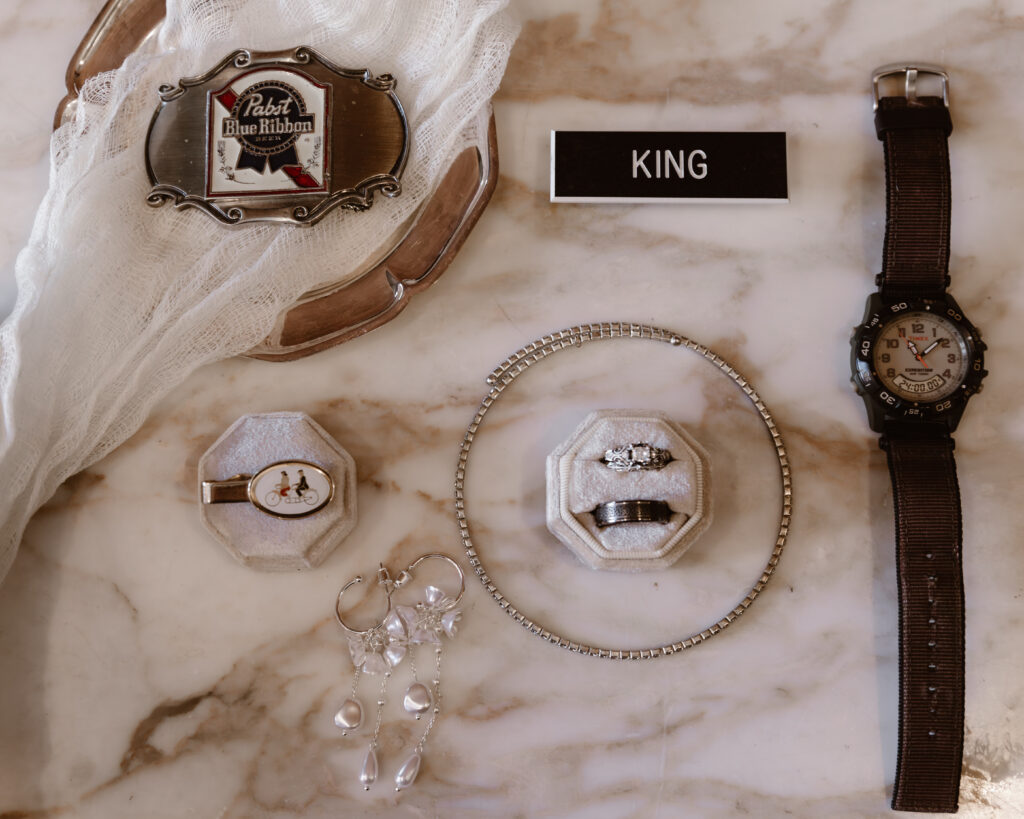 Flat lay of bride and groom details