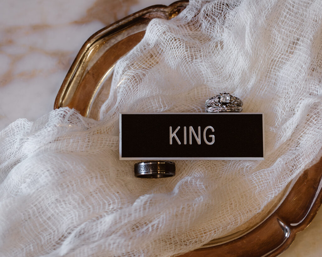 Groom's army name tag with bride and groom's wedding rings
