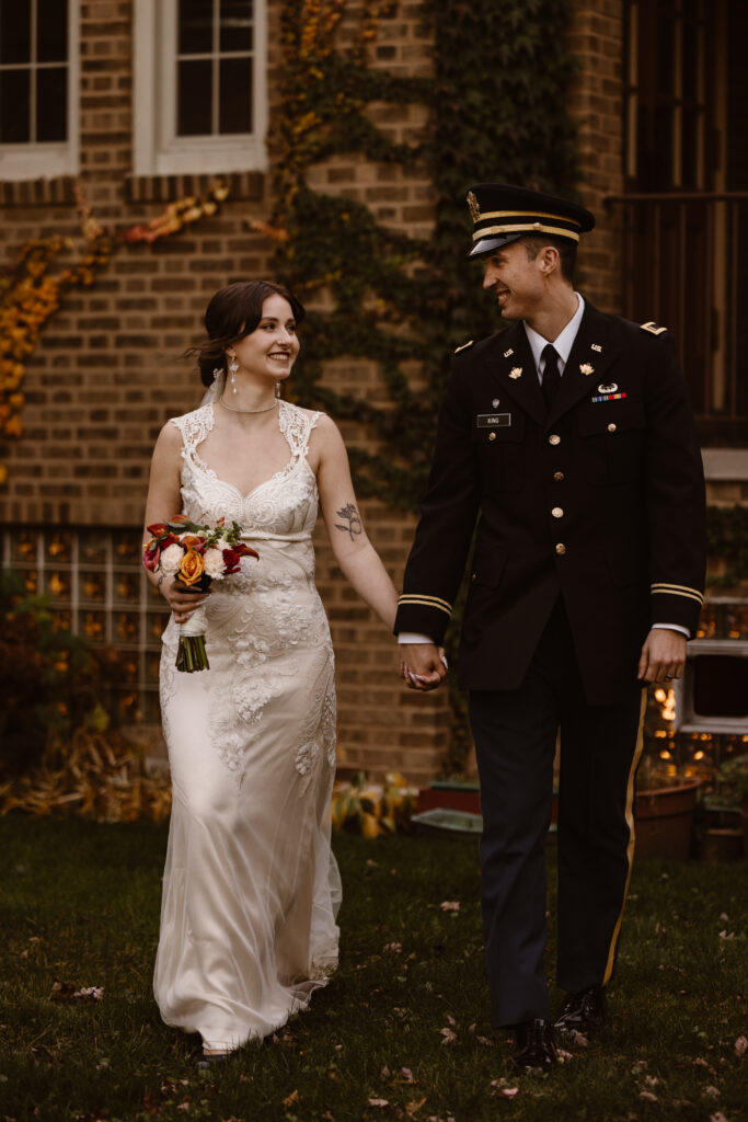 Bride and groom portrait, walking hand in hand