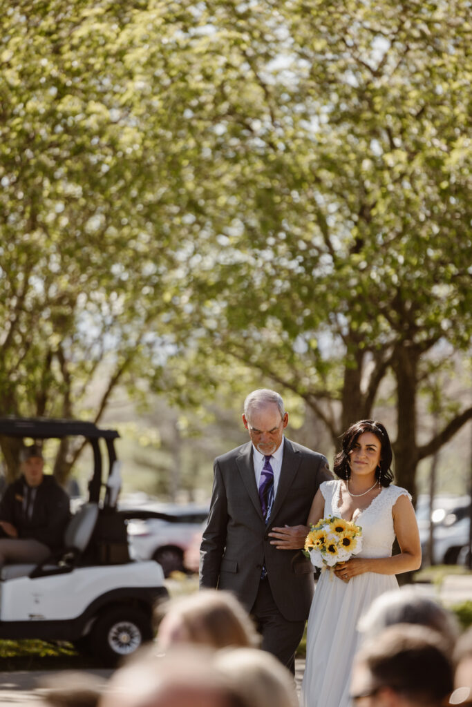 Bride walking down the aisle with her father.