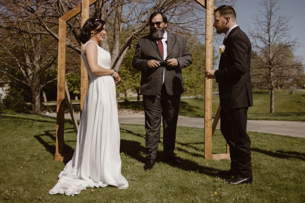 Bride and groom at their wedding ceremony about to exchange rings