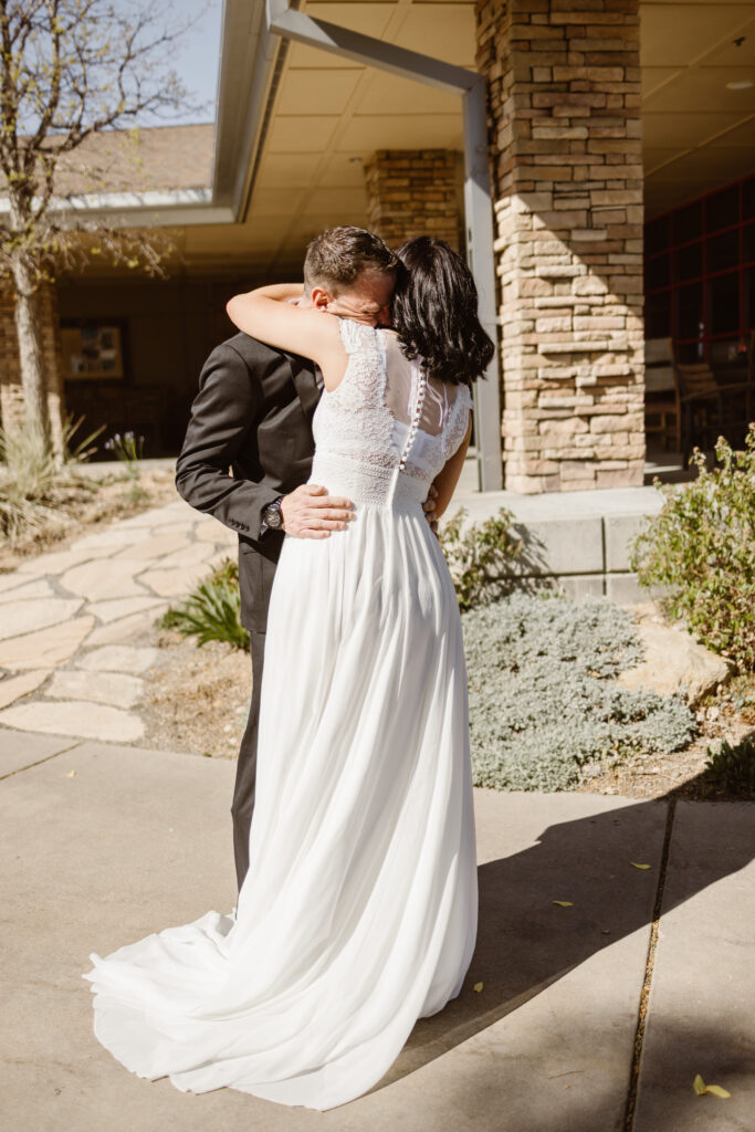 Bride and groom sharing a moment together after wedding ceremony at Walnut Creek Golf Preserve